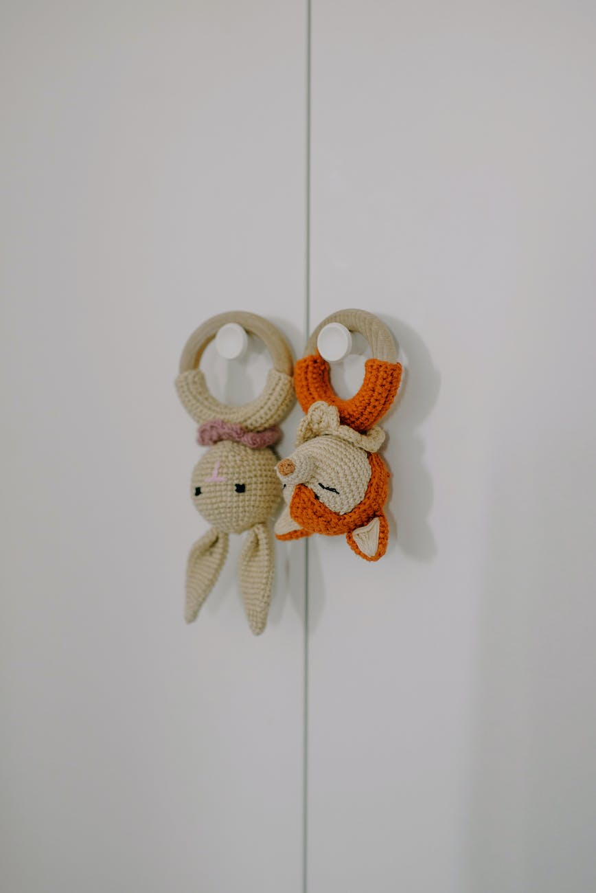 crotchet baby toys hanged on wall
